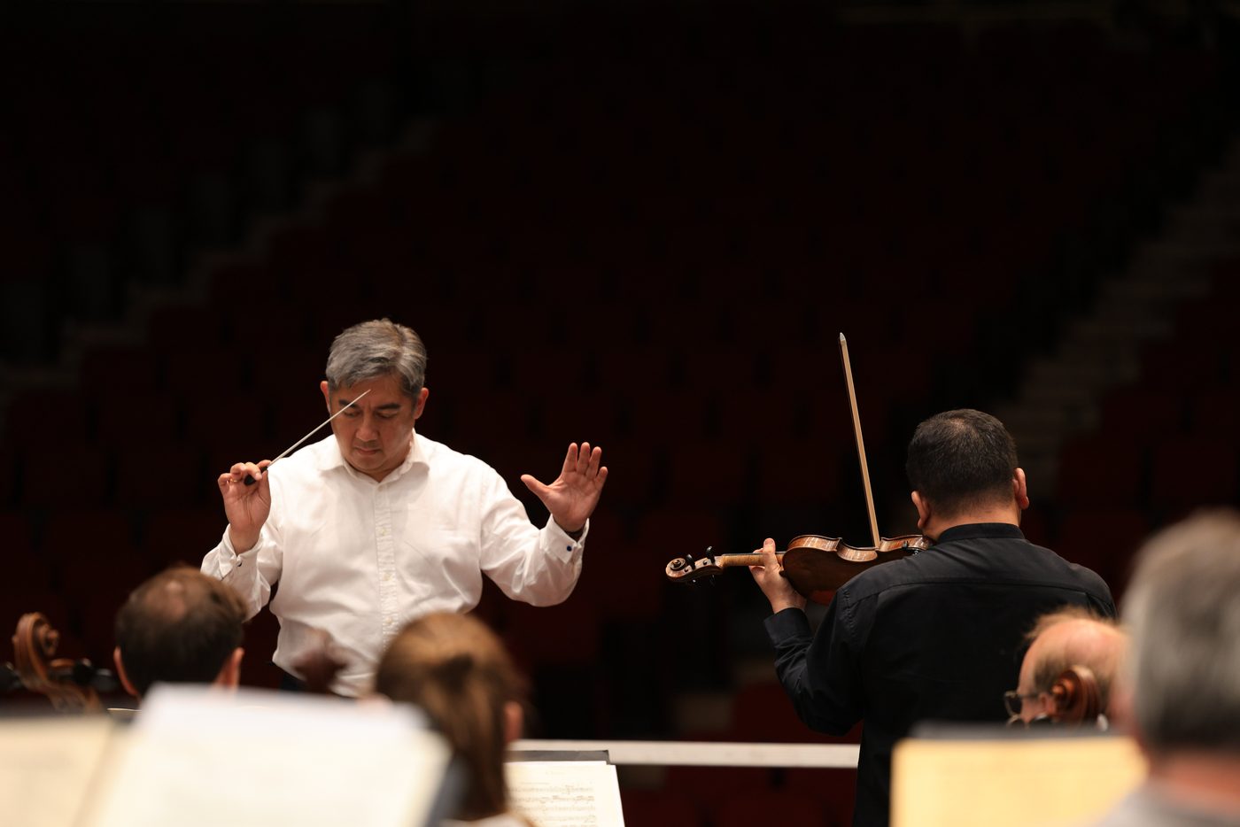 Adrian Prabava conducting with Edwin E.S. Kim