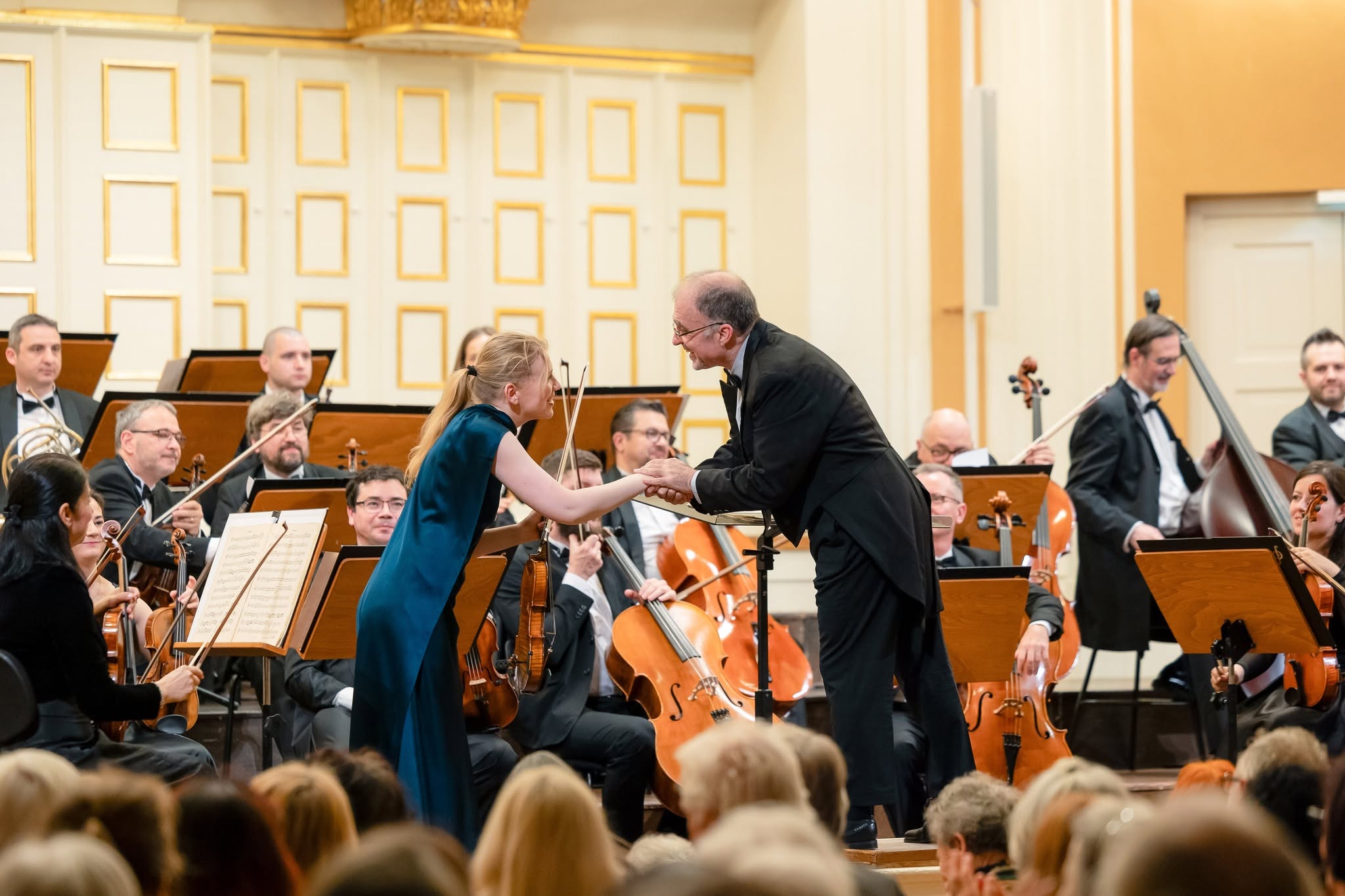 Nayden Todorov shakes hands with Charlotte Spruit at the curtain call