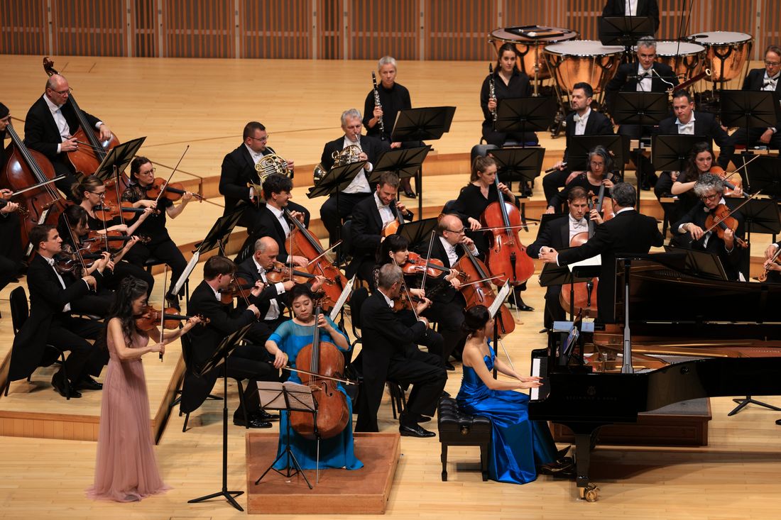Violinist Kyung Sun Lee, cellist Meehae Ryo and pianist Soyeon Kang with the orchestra